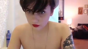Cute Tattooed Short-Haired Teen Playing Naked With A Dildo On Webcam