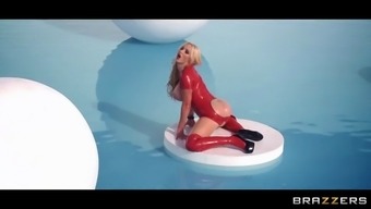 Nikki Benz Posing At The Water Park In A Red Latex Dress