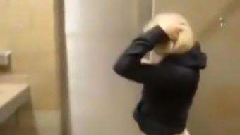 Sexy Blonde Sucks And Fucks In Public Bathroom Stall