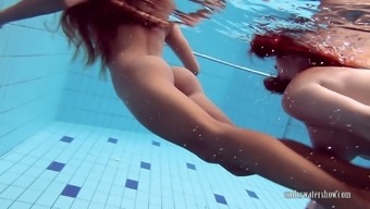 A Pair Of Attractive Teens Enjoying The Pool Like Beautiful Mermaids