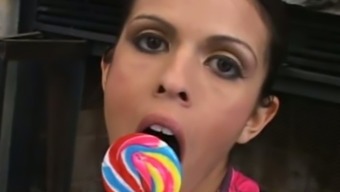 Wonderful Sexy Looking Buxom Brunette Teases Her Twat With A Lollipop