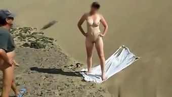 Brunette Milf Jerks And Sucks At The Beach