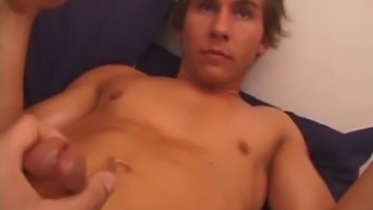 Sprawled Out On The Bed, Brock Labelli Pulls Out His Cock And Starts Stroking.