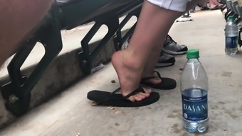 Coworker Feet In Flip Flops