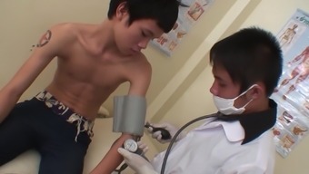 In The Medical Exam Room, The Kinky Doctor Begins Assessing His Skinny Asian Patient