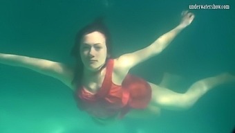 Red Dressed Mermaid Rusalka Swimming In The Pool