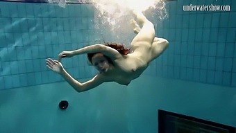 Hot Beauty Swims In The Sea Like A Mermaid