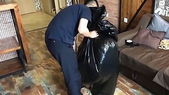 The Girl Struggled In The Trash Bag.