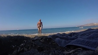 Hunky Couple Enjoys A Day At The Nude Beach In Santorini